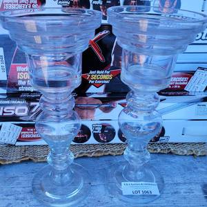 lot 1063 image: SET OF 2 GLASS CANDLE HOLDERS IN STYLE SHOWN.
