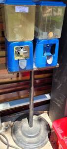 lot 1082 image: DOUBLE HEAD CANDY VENDING MACHINE WITH STAND IN CONDITION SHOWN.