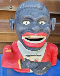 lot 1106 image: VINTAGE CAST IRON FIGURE COIN BANK AS SHOWN.