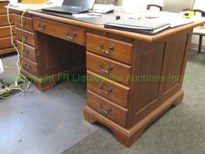 lot 77 image: Solid Oak double pedestal executive desk with double pullout trays and patinated handles, 24x60x36 in