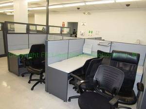 lot 128 image: (2) Modular office desk units. Includes privacy panels, bases, desk units, hanging storage (chairs and contents not included)