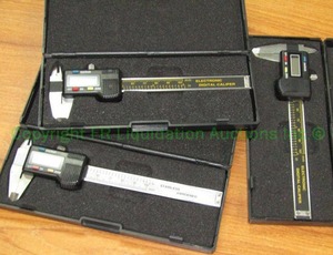 lot 153 image: Electronic digital portable calipers in cases