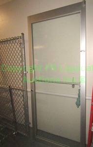 lot 179 image: Metal frame and tempered glass industrial door wdeadbolt, 84x36 in