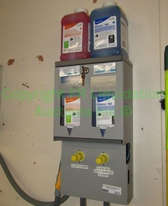 lot 211 image: Glass and multi surface cleaners and Diversey J-Fill Duo Cleaner Dispensing System with keys (mounted to wall buyer to remove)