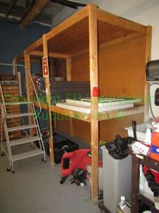 lot 213 image: Wood shelving unit (Buyer responsible for dismantling and moving) Contents not included, 84x84x4 in