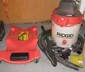 lot 215 image: RIDGID wheeled shop vacuum (model WD12000) and low profile creeper