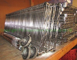 lot 216 image: Metro bakers rack utility shelf units (disassembled) with various shelves, side bars, wheels and back stops