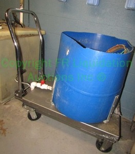 lot 244 image: HaulMaster hydraulic table cart Has been retrofitted with welded frame to move modified barrel with spout