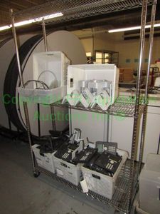 lot 401 image: Metro bakers utility storage rack with Avaya phones and angled stations Includes contents
