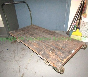 lot 298 image: Wood platform wheeled warehouse cart with metal handle, 5x2 ft