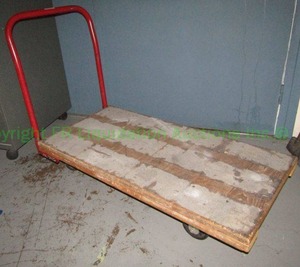 lot 297 image: Wood platform wheeled warehouse cart with metal handle, 4x3 ft