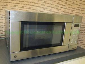 lot 733 image: General Electric stainless steel microwave oven