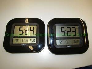 lot 715 image: Timex Atomic wall clocks