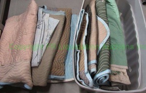 lot 265 image: Assorted and quilted furniture pads as shown Bin included