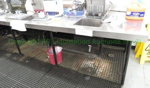 lot 465 image: Stainless steel table with double sinks unit, 84x48x36 in. Buyer to remove. Please bring assistance (Steam units not included)