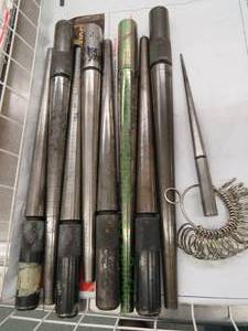 lot 509 image: 9 metal ring sizer mandrels in metal basket plus a ring sizer