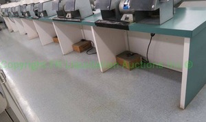 lot 522 image: Green laminate and wood work station, 27ft long (Contents not included)