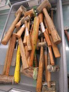lot 552 image: Lapidary tools including wood and metal mallets, ball peen hammers and ring sizing tools