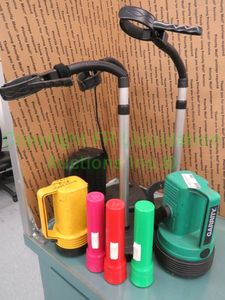 lot 556 image: Eveready and Garrity flashlights plus holder stands