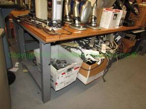 lot 281 image: Wood top metal base work table, 2x8x3 ft. Buyer to remove Please bring assistance Contents not included