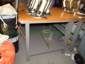 lot 280 image: Wood top metal work table. Buyer to remove Please bring assistance Contents not included