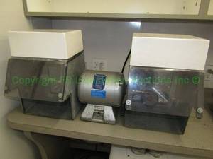 lot 702 image: Baldor 14-hp lighted polishing lathe station (mounted to bench, buyer must remove)