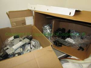 lot 455 image: Assorted modular brackets, glides, and parts