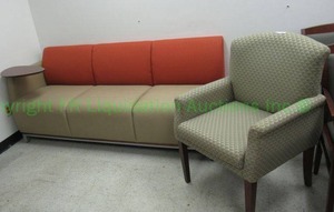 lot 450 image: National Swift 3 seat upholstered reception sofa with attached table and Kimball International upholstered chair Model QN69EE