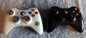 lot 38 image: PAIR OF XBOX GAMING CONTROLLERS