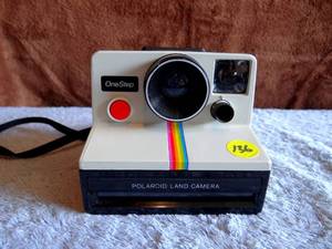 lot 136 image: VINTAGE Polaroid One Step Rainbow Strip Land Camera