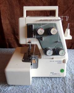 lot 157 image: Janome New Home Mylock Serger Model 234D Sewing Machine