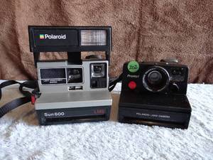lot 202 image: VINTAGE POLOROID SUN 600 & PRONTO LAND CAMERA