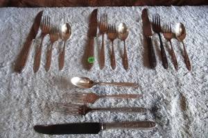 lot 291 image: DELUXE STAINLESS PLACE SETTING FOR 4 AS SHOWN