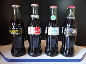 lot 30 image: LOT OF 4 COCA COLA UNOPENED BOTTLES FROM RENOWNED EVENTS AS SHOWN