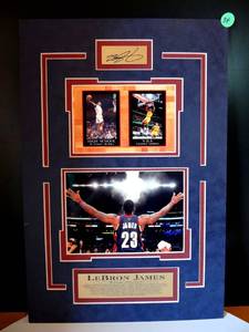 lot 34 image: LEBRON JAMES - UNIQUE MATTED PHOTO DISPLAY WITH METAL BIO PLATE AND AUTOGRAPH FACSIMILE - MEASURES 11 12 X 17