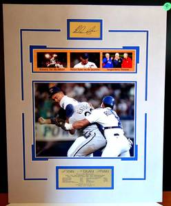 lot 36 image: NOLAN RYAN LEGENDARY MOMENTS MATTED PHOTO DISPLAY WITH METAL FACSIMILE SIGNATURE & BIO PLATE - MEASURES 16 X 20