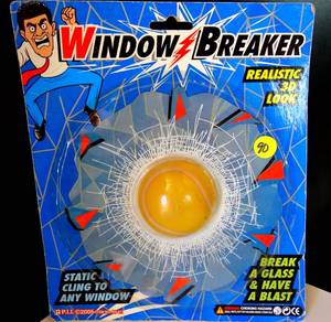 lot 90 image: WINDOW BREAKER - 3D TENNIS BALL SMASHED WINDOW GAG - NIP