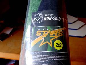 lot 207 image: DALLAS STARS NON SKID TUFTED AREA RUG - NEW IN SEALED WRAP - MEASURES 39 X 59