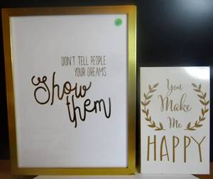 lot 257 image: LOT OF 2 - GOLD TONE MOTIVATIONAL WALL HANGING PRINTS
