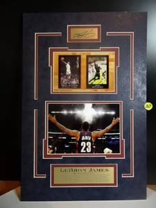 lot 267 image: LEBRON JAMES - UNIQUE MATTED PHOTO DISPLAY WITH METAL BIO PLATE AND AUTOGRAPH FACSIMILE - MEASURES 11 12 X 17