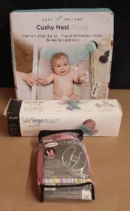 lot 38 image: Baby Delight Cushy Nest Cloud Infant Bather, 0-6 Months SaferSleeper, and Summer Cradler Head Support