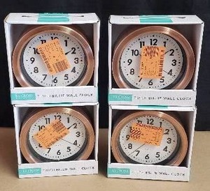 lot 42 image: Lot of 4 La Crosse Clock Co. 7 Copper Finish Billie Wall Clocks