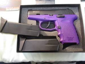 lot 3 image: 9-MM...SCCY CPX-2, 9-MM Pistol In box and complete. 3.1 inch barrel 101 capacity 9mm with carbon black slide, purple polymer Lower And Grips and extra magazine.
