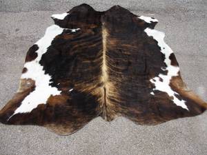 lot 132 image: Brown Tricolor Brindle Cowhide Rug