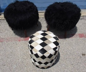 lot 20 image: 3-Lot,2-4-Walnut Leg, BiBi Black Long Hair LLama Fur Round Stools, and 1-No Leg-Diamond Pattern Cow Hide, Round-Ottoman