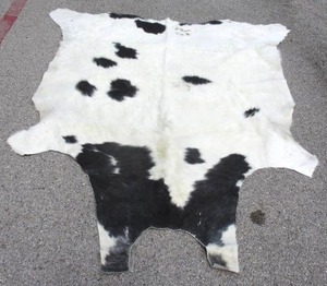 lot 31 image: Multi Color Cow Hide Rug