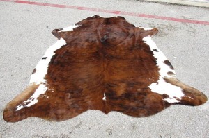 lot 56 image: Brown Tricolor  Brindle Cowhide Rug