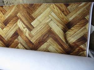 lot 42 image: Unused Roll Of Quietex Acoustic  Fabrics, Polyester, Chevron Wood Look, Acoustical  Wall  Floor Covering