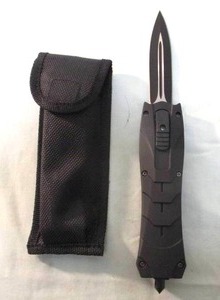 lot 24 image: NEW-OTF Automatic Pocket Knife, With 3-78 double edge, blood groove, dagger style blade, rubber like grip, glass breaker, belt clip and sheath
