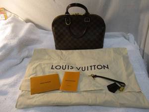 lot 103 image: LOUIS VUITTON (Toiles et cuirs) Damier Ebene Alma PM Monogram Handbag  Tote, With Lock and 2-Keys,And Dust CoverBag